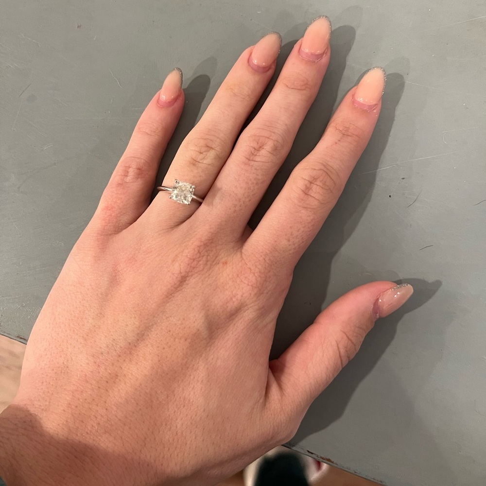 1.77 carot cushion cut diamond ring in white gold. Sized to about a 5.